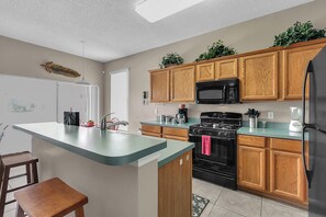 House, Multiple Beds, Pool Access, Pool View (Goofy's Golf Retreat) | Private kitchen | Coffee/tea maker, dining tables - Goofy's Golf Retreat (Davenport)