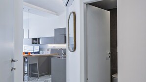 A modern kitchen with a marble floor, a built-in oven, and a sink. - Studio Piccolo a Carignano by Wonderful Italy (Genoa)