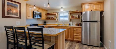 Coffee/tea maker, fridge, microwave, oven
