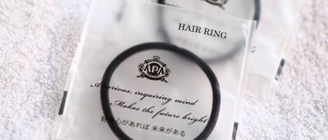 A hair ring package with text on it.