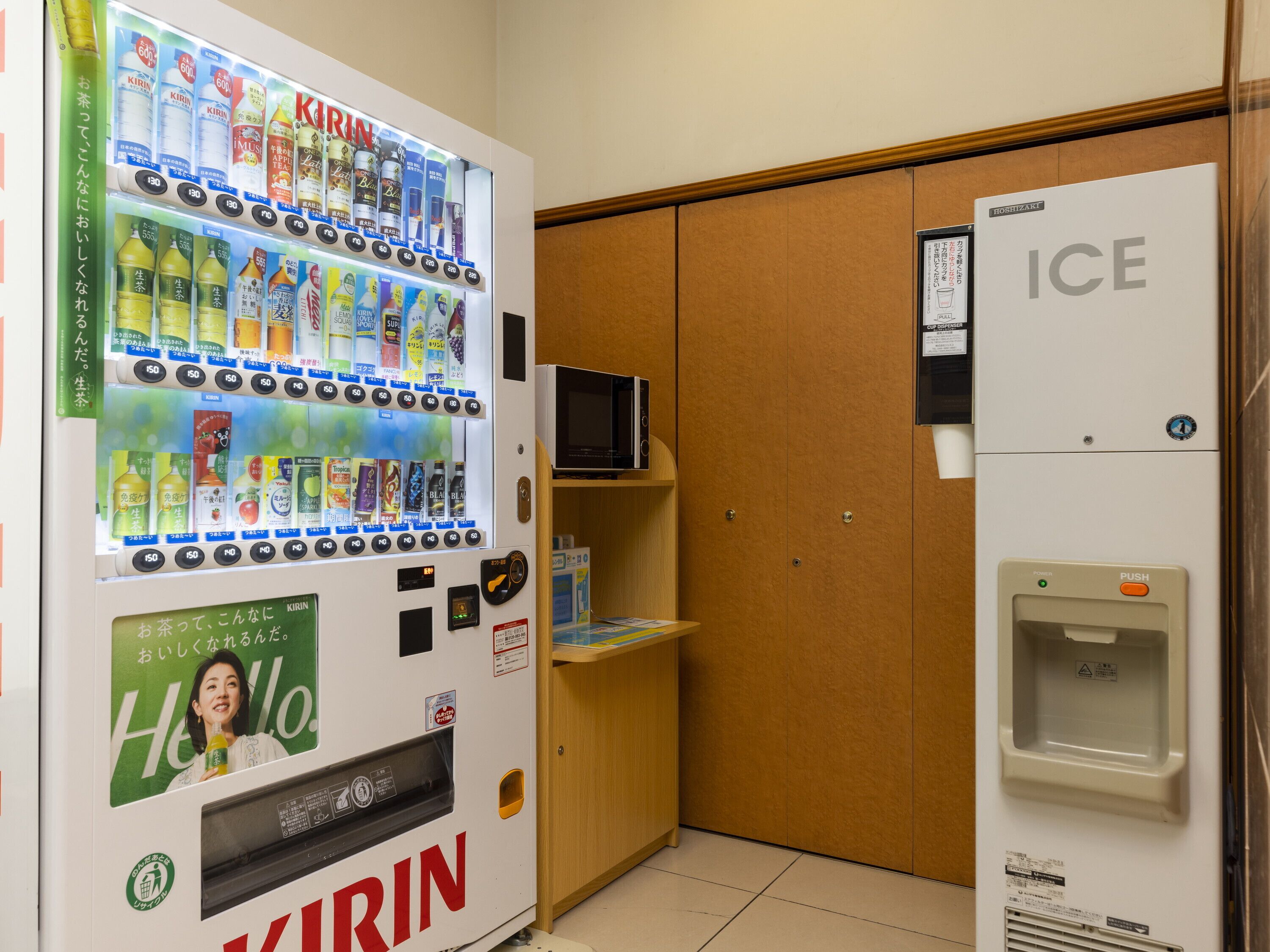 A vending machine with various beverages and a refrigerator with a water dispenser.