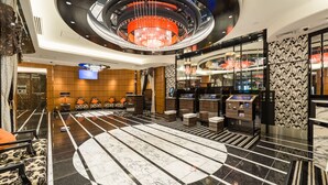 A spacious lobby with a central chandelier, seating area, and a reception desk. - APA Hotel Ueno Ekimae (Tokyo)