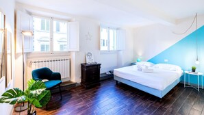 A bedroom with a bed, a chair, a dresser, and a radiator. - Historic center⭐ Minutes to attractions, Train and River (Firenze)