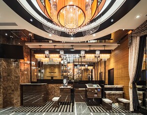 A luxurious lobby with a grand chandelier, marble flooring, and a reception desk. - APA Hotel Nishifunabashi Ekimae (Funabashi)