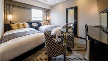 Deluxe Twin Room | Down comforters, desk, laptop workspace, blackout drapes