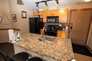 Fridge, microwave, oven, stovetop - Enjoy Some of the Best Mountain Views In Canmore, Falcon Crest Lodge (Canmore)