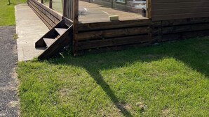 A mobile home with a deck and a ramp, labeled "41 The Lodge."