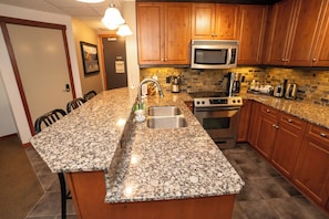 Fridge, microwave, oven, stovetop - Enjoy a Cozy Condo and Lots of Fun with Family Friendly Pool and Hot Tubs (Canmore)