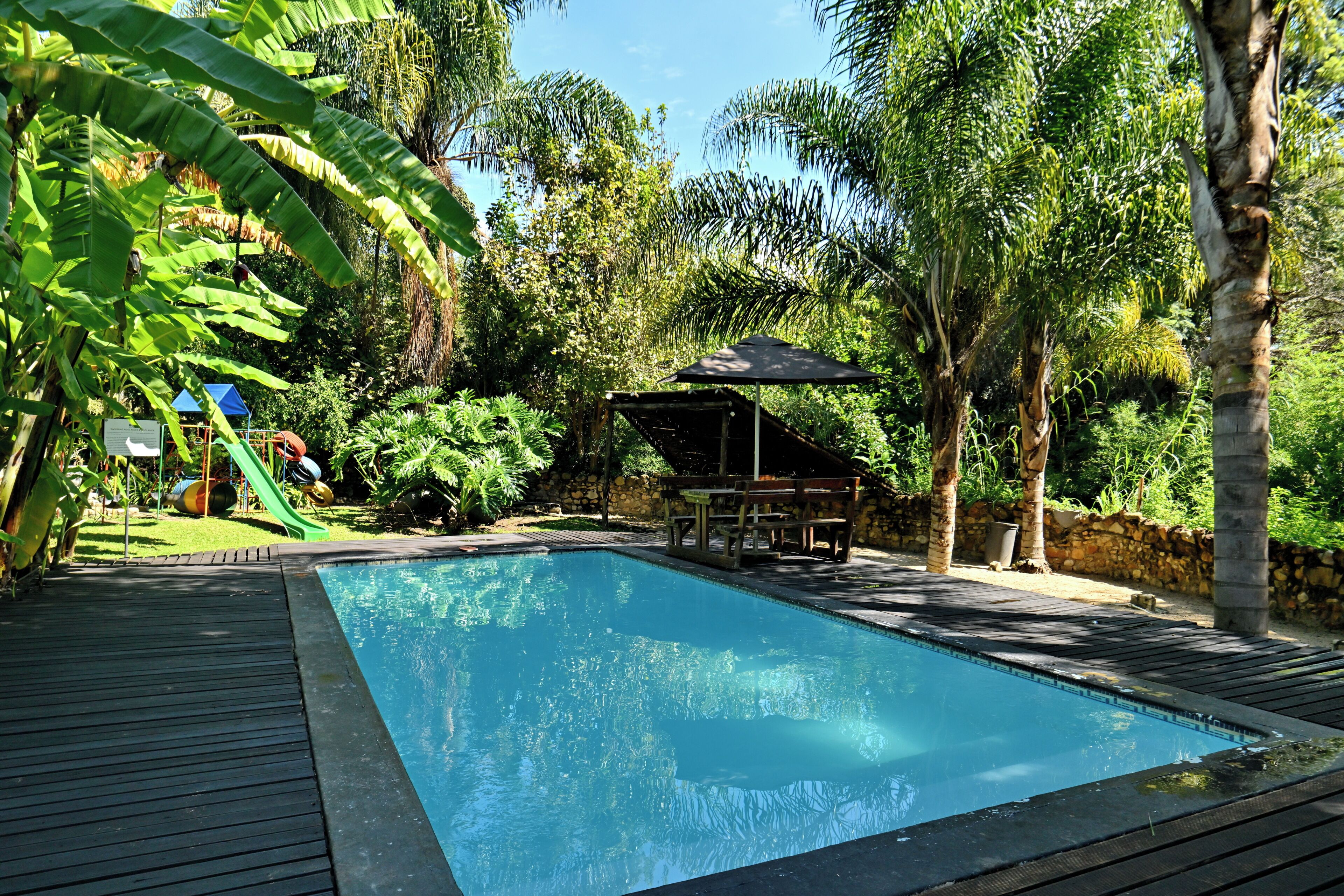 Indoor pool, outdoor pool, pool umbrellas, pool loungers