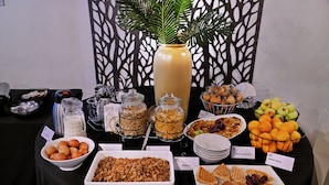 A buffet table with various food items and labels. - BON Hotel Rustenburg (Rustenburg)