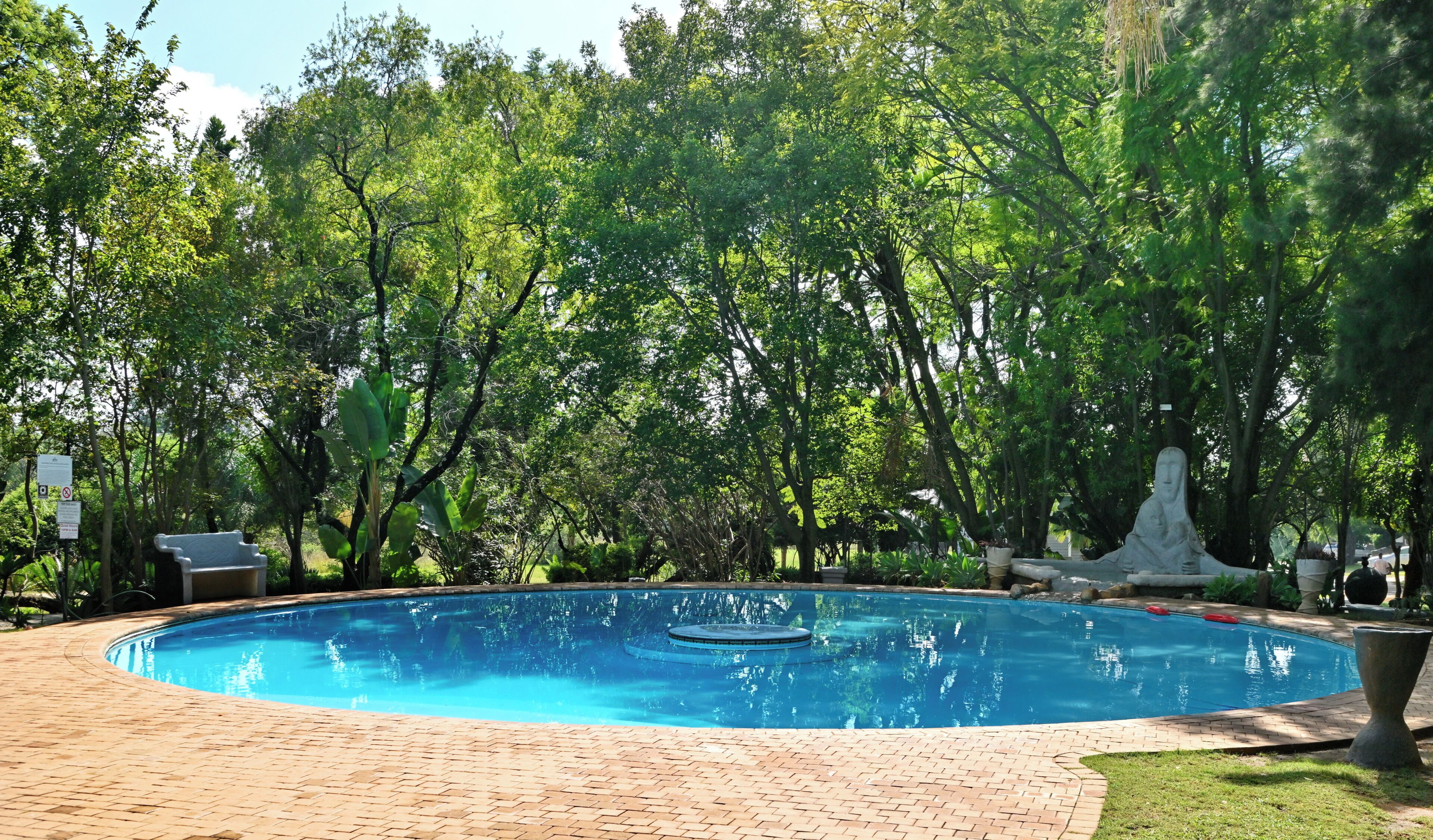 Indoor pool, outdoor pool, pool umbrellas, pool loungers