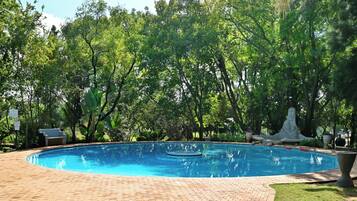 Indoor pool, outdoor pool, pool umbrellas, pool loungers