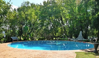 Indoor pool, outdoor pool, pool umbrellas, sun loungers