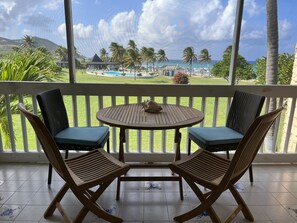 Outdoor dining - Sunset Reef: An Oceanfront 3 Bedroom Condo in Gentle Winds (Christiansted)