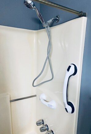 Bathtub, hair dryer, towels, soap