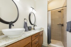 Combined shower/tub, hair dryer, towels, soap