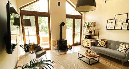 This beautifull villa is located by the wather, surrounded by forest.