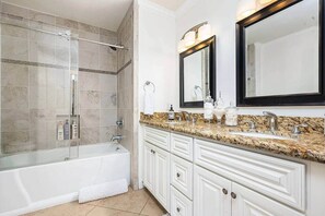 Combined shower/tub, hair dryer, towels, soap