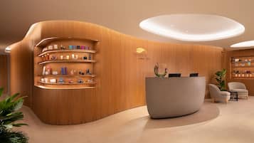 Welcome to the reception area, where guests can check in and enjoy a selection of amenities on display.