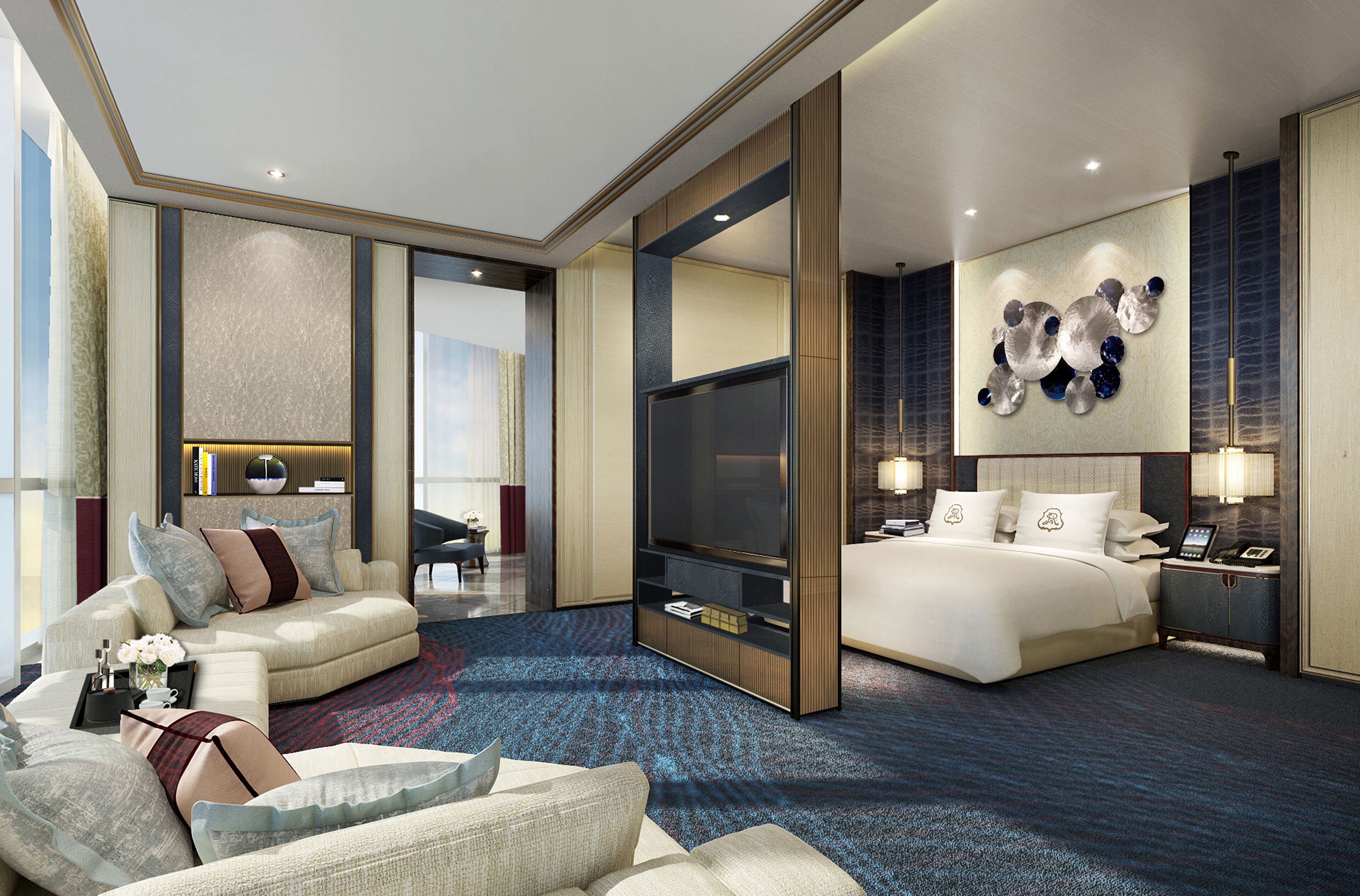 Une chambre d’hôtel moderne équipée d’un grand lit, d’un canapé, d’une télévision et d’un bureau.