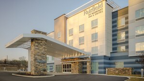 A Marriott Inn & Suites building with a stone facade, large windows, and a covered entrance. - Fairfield Inn & Suites by Marriott Knoxville Northwest (Knoxville)
