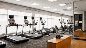 A gym with multiple treadmills, weight machines, and a wooden reception desk. - Fairfield Inn & Suites by Marriott Knoxville Northwest (Knoxville)