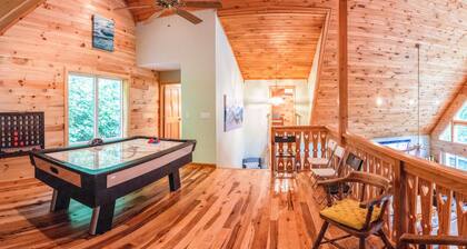 Secluded dog-friendly home with lake access, fireplace, firepit, deck & games