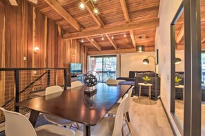 Cozy dining area with a wooden table and comfortable seating.