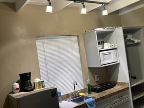 Fridge, microwave, stovetop, coffee/tea maker