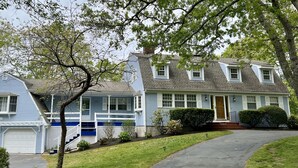 A two-story house with a garage, a front porch, and a well-maintained lawn. - RUSH SALE- Family Discount! Weeks of Aug 22-Sept 5th!!! (Dennis)