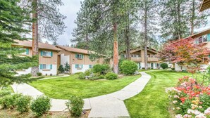 A residential building with a well-maintained lawn and a pathway leading to the entrance. - Wander in to Alpine, a basecamp for your adventure!! (Leavenworth)