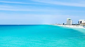 On the beach, sun loungers, beach towels