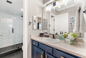 Combined shower/tub, hair dryer, towels, soap
