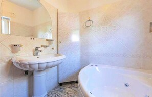 Bathtub, hair dryer, towels