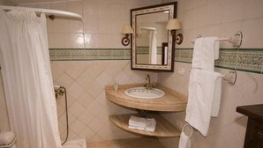 A bathroom with a sink, mirror, towel rack, and shower curtain. - Finca Casa Nanita B (Moya)