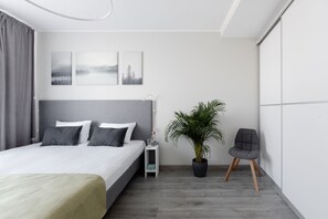 Habitación Deluxe | Ropa de cama de alta calidad y caja de seguridad en la habitación 