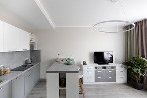 Suite junior | Ropa de cama de alta calidad y caja de seguridad en la habitación 