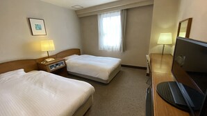 A hotel room with two beds, a desk with a computer, a TV, a window with curtains, and a bedside lamp. - Smile Hotel Nabar (Nabari)