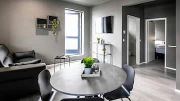 Standard Apartment, 1 Bedroom, Balcony | Living room | 55-inch Smart TV with digital channels, TV
