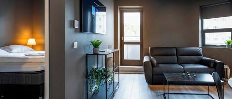 Standard Apartment, 1 Bedroom, Balcony | Living room | 55-inch Smart TV with digital channels, TV