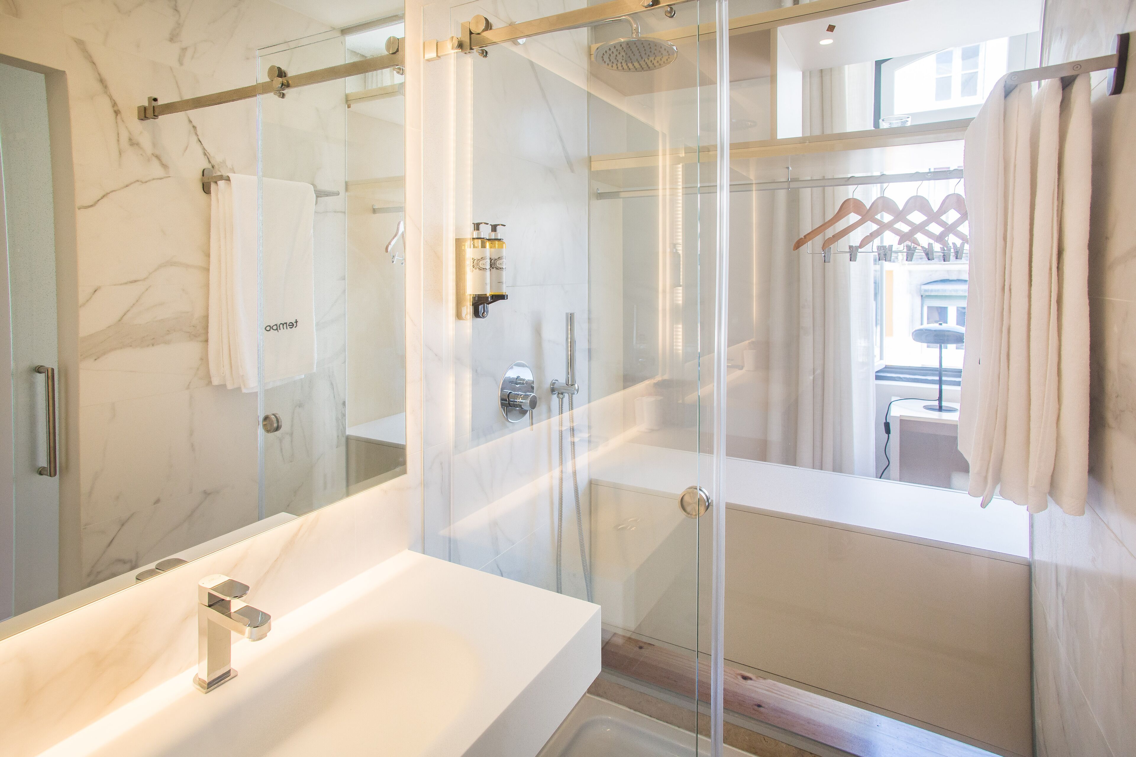 deluxe double room | bathroom | hair dryer, towels