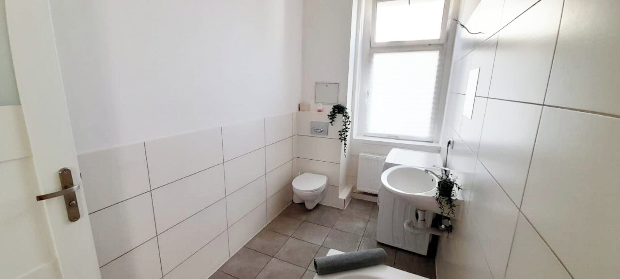 Bathtub, towels, soap, toilet paper