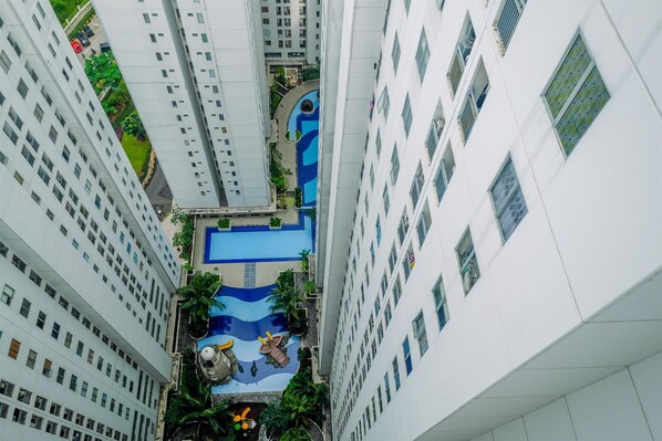 Outdoor pool - Cozy Stay 2BR Bassura City Apartment (Jakarta)