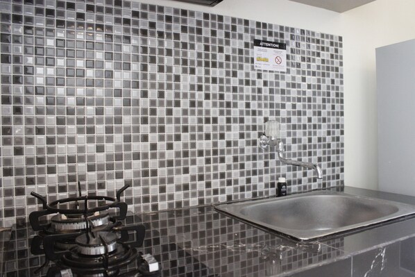 Room | Private kitchen | Fridge, stovetop, dishwasher, cookware/dishes/utensils - Chic and Comfy 2BR Apartment at Parahyangan Residence near UNPAR (Bandung)