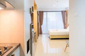Room | Free WiFi, bed sheets - Comfy Studio At Dago Suites Apartment (Bandung)