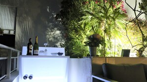 A room with a white cabinet, a couch, and a potted plant. - Rooftop Croisette/alexandre III (CANNES)
