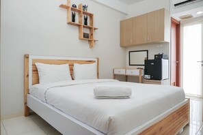 Room | Free WiFi, bed sheets - Comfort Studio Apartment at Margonda Residence 4 near UI (Depok)