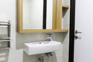 Room | Bathroom | Shower, free toiletries, towels - Cozy and Comfortable Studio (No Kitchen) Apartment at Mustika Golf Residence (Cikarang)