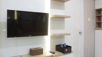 Quarto | Área de estar | TV