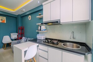 Fridge, stovetop, dishwasher, cookware/dishes/utensils - Clean and Simply Cozy 2BR Bassura City Apartment (Jakarta)